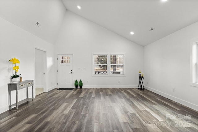 interior space with dark hardwood / wood-style floors and high vaulted ceiling