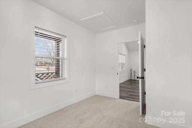 empty room with light colored carpet