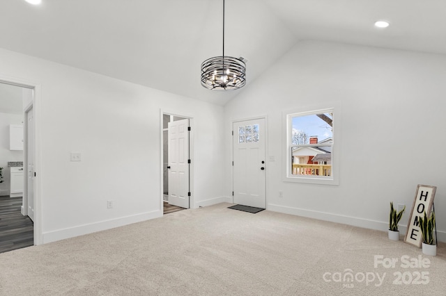 interior space featuring lofted ceiling and carpet flooring