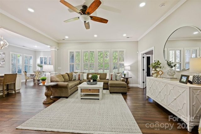 living room with dark wood-type flooring, ceiling fan, ornamental molding, and ornate columns