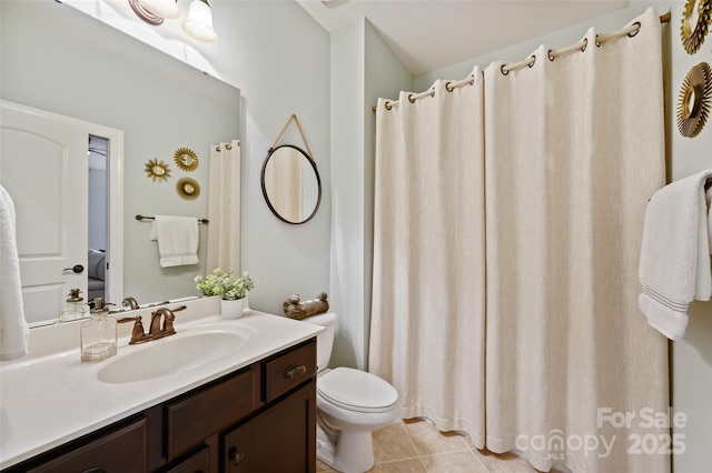 bathroom featuring tile patterned floors, toilet, and vanity