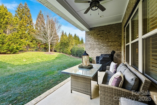 view of patio / terrace featuring ceiling fan