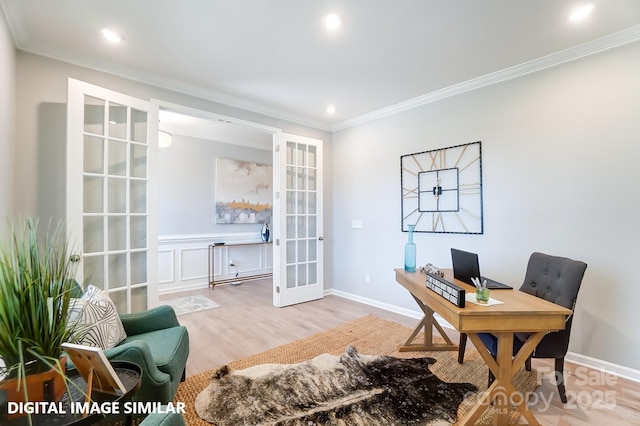 office with ornamental molding, light hardwood / wood-style floors, and french doors