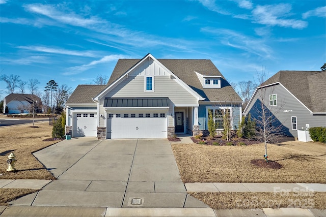 craftsman house featuring a garage and a front yard