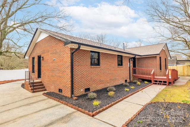 view of side of property featuring a deck