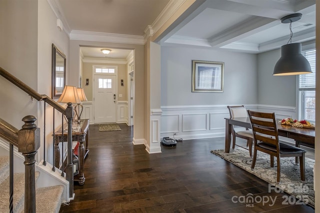 entrance foyer with crown molding, coffered ceiling, dark hardwood / wood-style floors, and beam ceiling