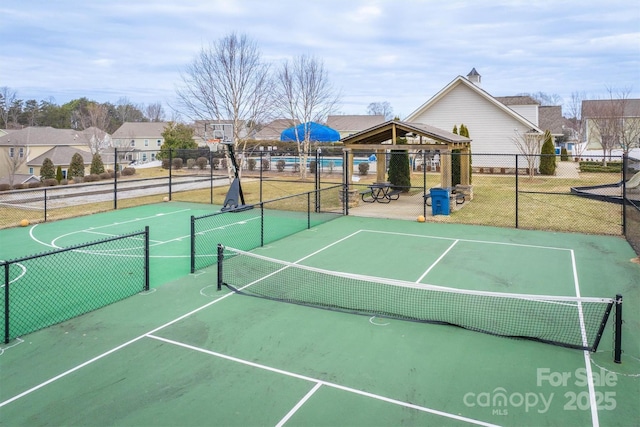 view of sport court with a gazebo and basketball hoop