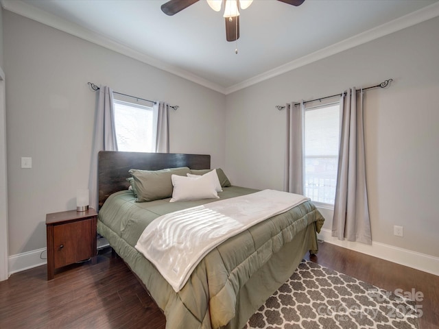 bedroom with dark hardwood / wood-style flooring, ornamental molding, and ceiling fan