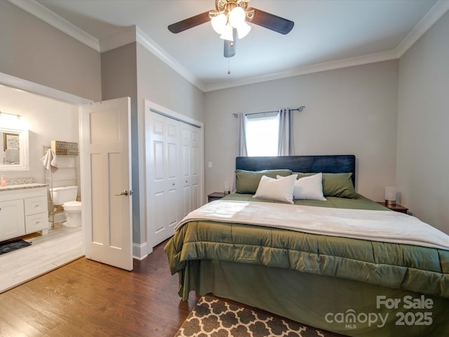 bedroom with crown molding, ensuite bath, a closet, hardwood / wood-style flooring, and ceiling fan