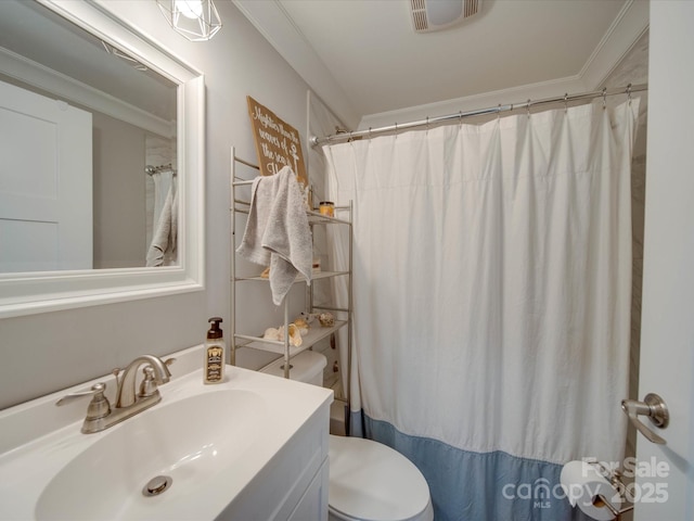 bathroom featuring crown molding, walk in shower, vanity, and toilet