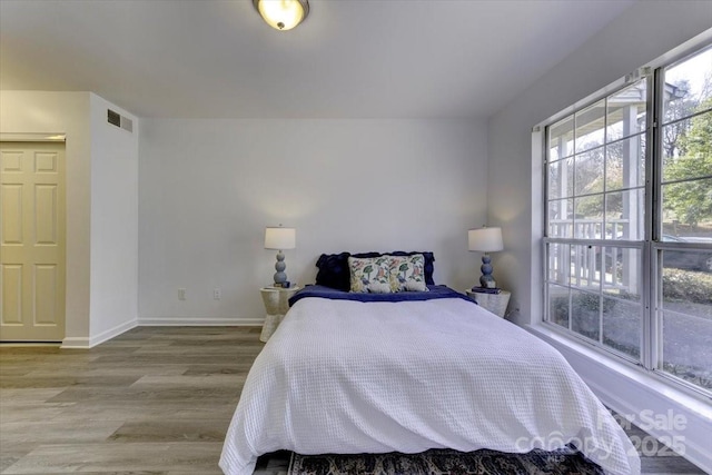 bedroom featuring light hardwood / wood-style floors