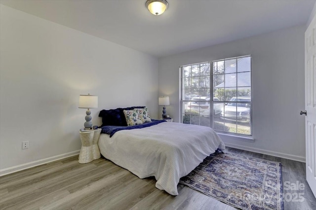 bedroom with wood-type flooring