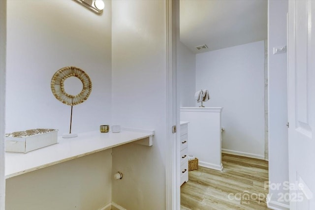 bathroom with hardwood / wood-style flooring