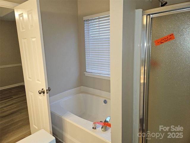 bathroom featuring plus walk in shower