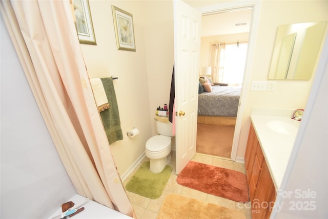 bathroom with vanity and toilet