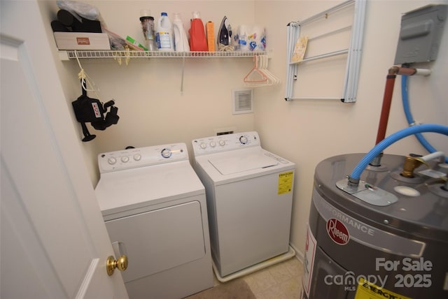 washroom featuring washer and dryer