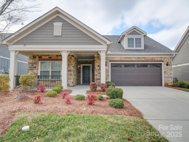 view of front of house with a garage and covered porch