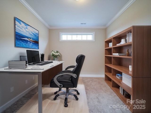 home office featuring ornamental molding and light carpet