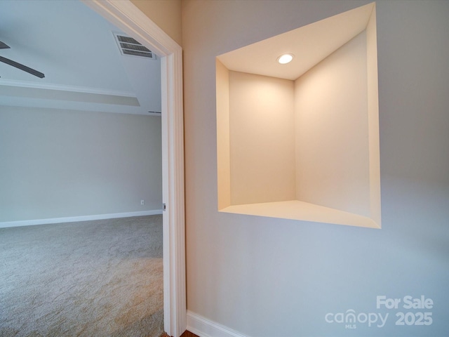 corridor with carpet flooring