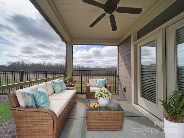 balcony with outdoor lounge area and ceiling fan