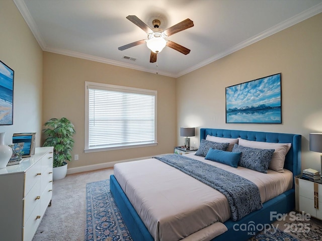 carpeted bedroom with ceiling fan and ornamental molding