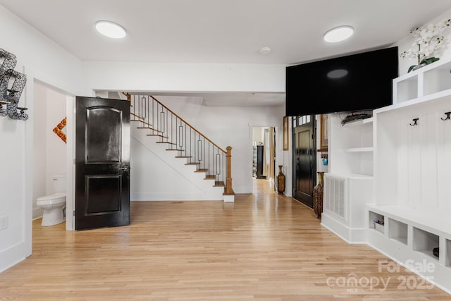 mudroom featuring light hardwood / wood-style floors and built in features