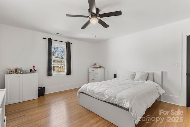 bedroom featuring light hardwood / wood-style flooring and ceiling fan