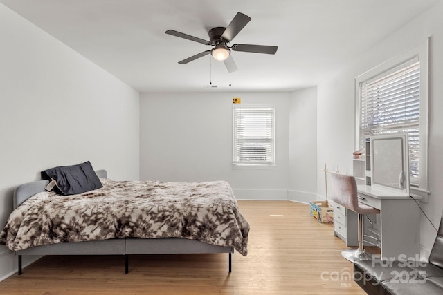 bedroom featuring ceiling fan and light wood-type flooring