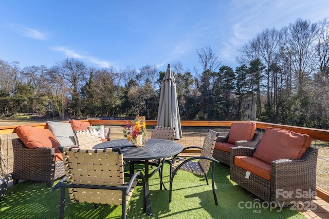 wooden terrace with a yard