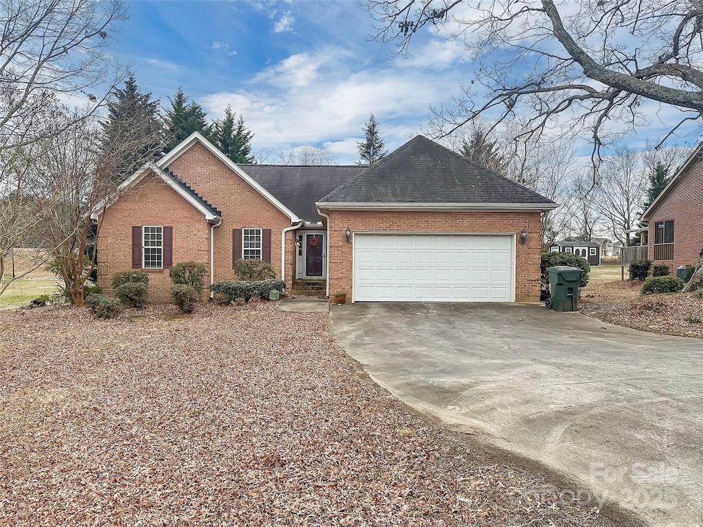 single story home featuring a garage