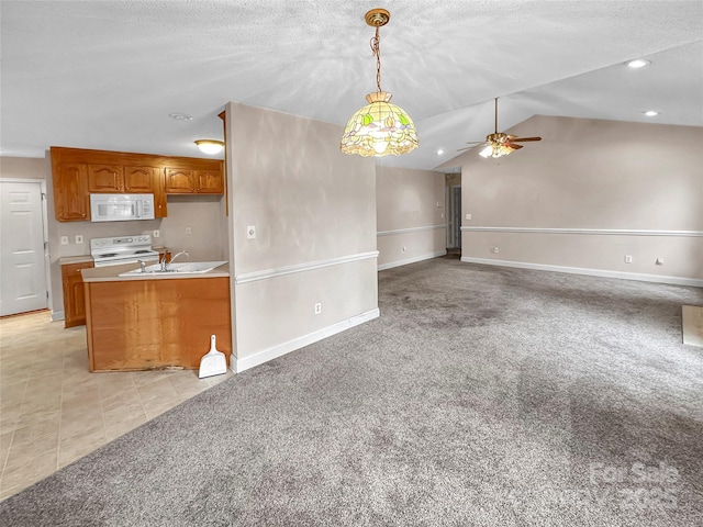 kitchen featuring sink, white appliances, ceiling fan, hanging light fixtures, and light colored carpet