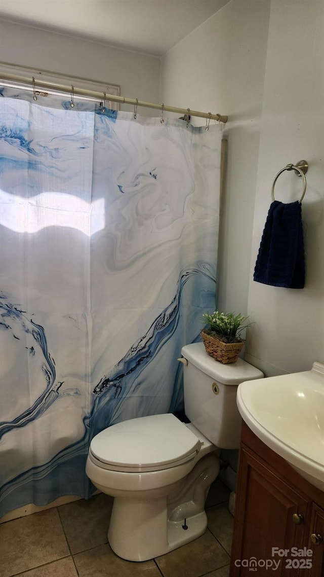 full bathroom featuring vanity, curtained shower, tile patterned flooring, and toilet