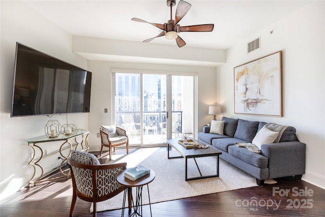 living room with ceiling fan and wood-type flooring