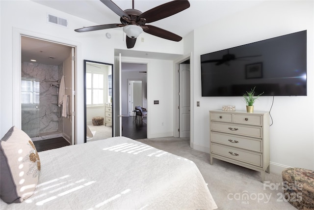 carpeted bedroom with ceiling fan and connected bathroom