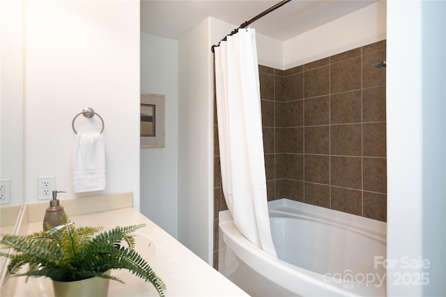 bathroom with shower / bath combination with curtain and vanity