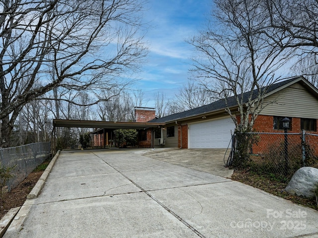 ranch-style home with a garage and a carport