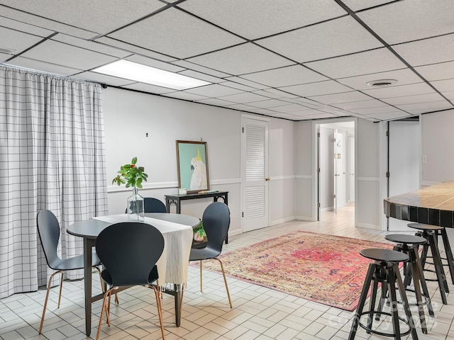 dining room featuring a paneled ceiling