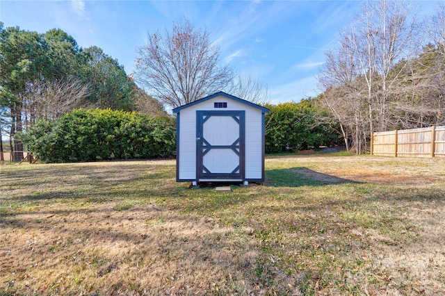 view of outbuilding with a yard