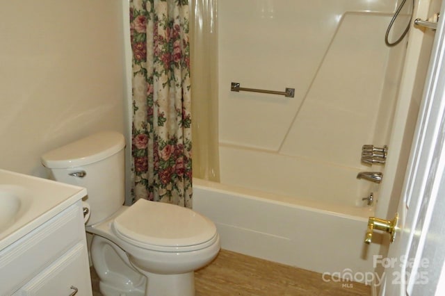 full bathroom featuring vanity, toilet, shower / tub combo, and wood-type flooring