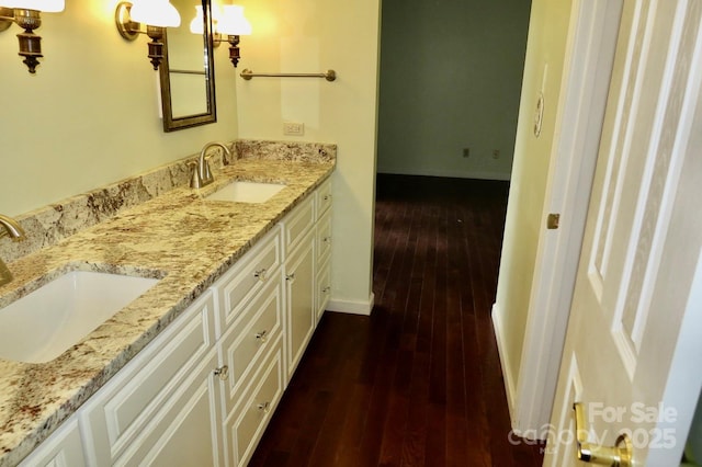 bathroom with vanity and hardwood / wood-style floors