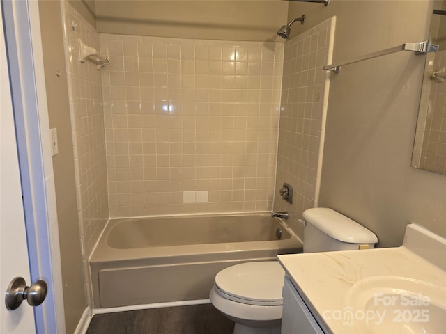 full bathroom with vanity, toilet, and washtub / shower combination