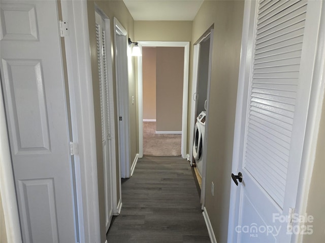 corridor with dark hardwood / wood-style flooring