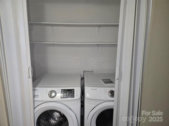 laundry room with washing machine and dryer