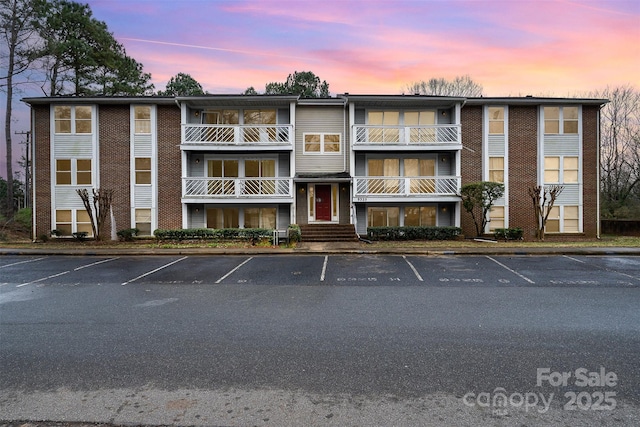 view of outdoor building at dusk