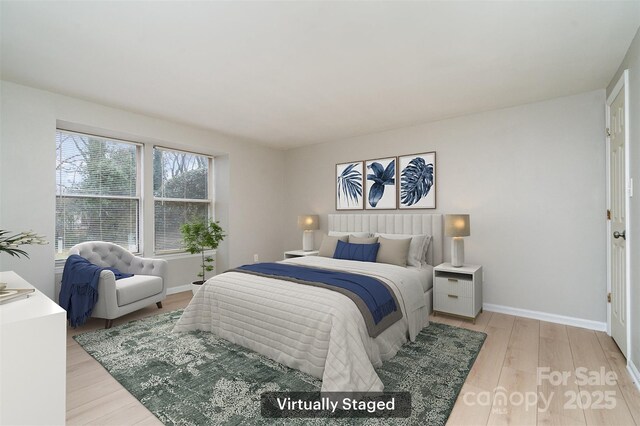 bedroom with light wood-type flooring