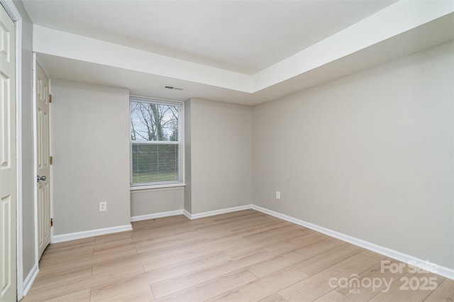 empty room with light hardwood / wood-style floors