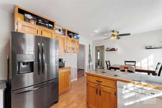 kitchen featuring ceiling fan, stainless steel fridge with ice dispenser, light hardwood / wood-style floors, and dishwasher