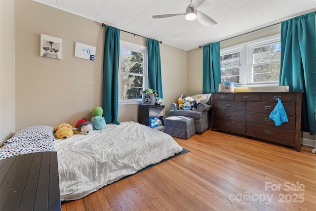 bedroom featuring light wood-type flooring and ceiling fan