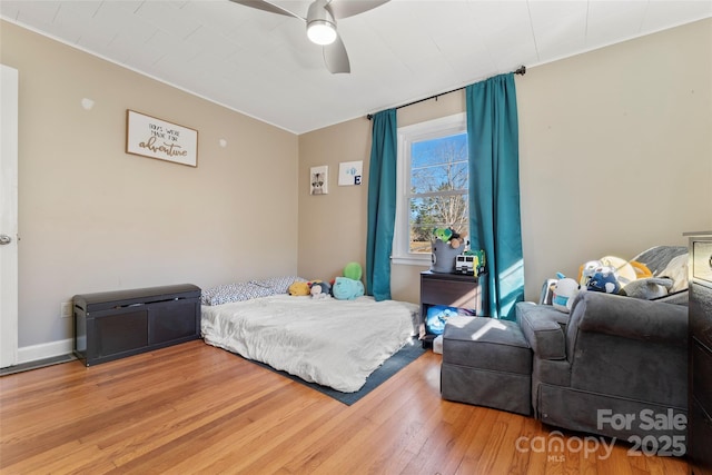 bedroom featuring ceiling fan and wood-type flooring