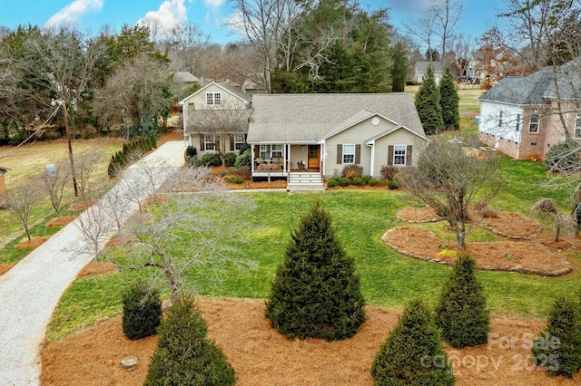 view of front of house featuring covered porch and a front lawn